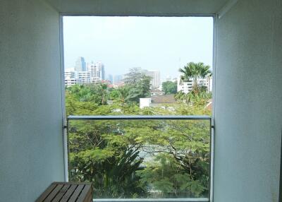 Balcony with a view and wooden bench