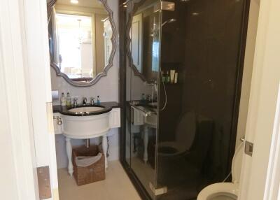 A modern bathroom with a shower and sink