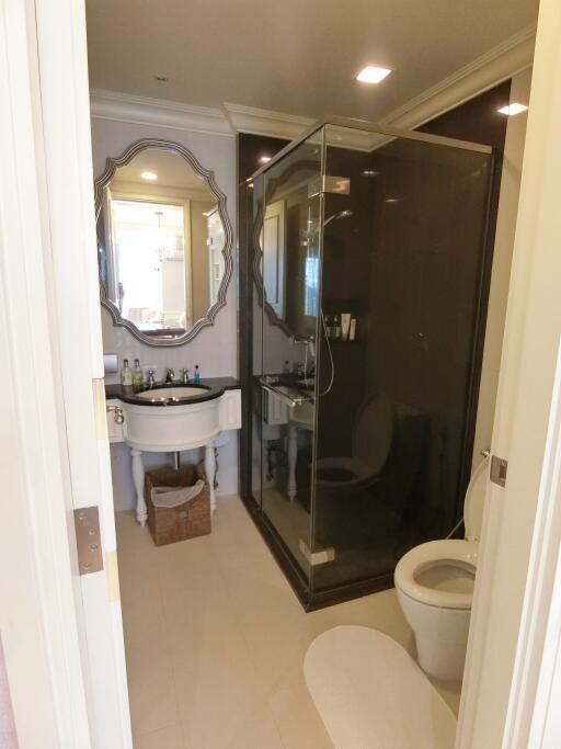 A modern bathroom with a shower and sink