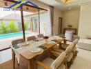 Modern dining area overlooking a pool with a large sliding glass door