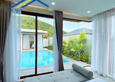 Bedroom with a view of a swimming pool and outdoor area