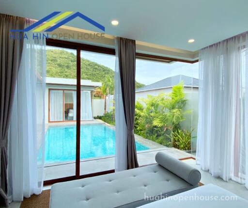 Bedroom with a view of a swimming pool and outdoor area