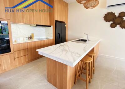 Modern kitchen with island and wooden cabinetry