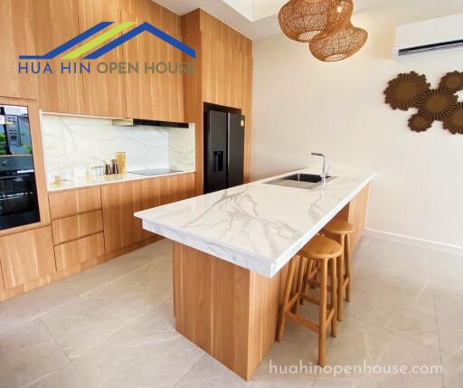 Modern kitchen with island and wooden cabinetry