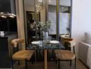 Contemporary dining area with a modern chandelier