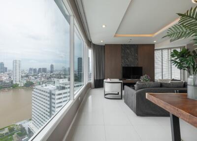 Spacious living room with large windows and city view