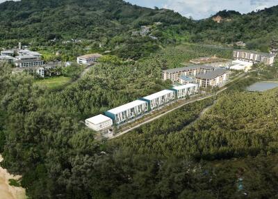 Aerial view of residential buildings amidst forested area