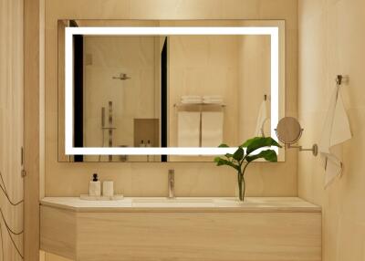 Modern bathroom with a large mirror and vanity