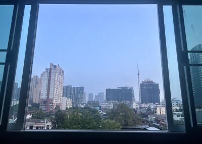 View of the city skyline through a window