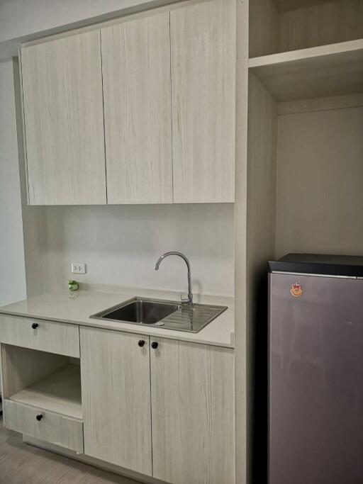 Modern compact kitchen with sink and fridge