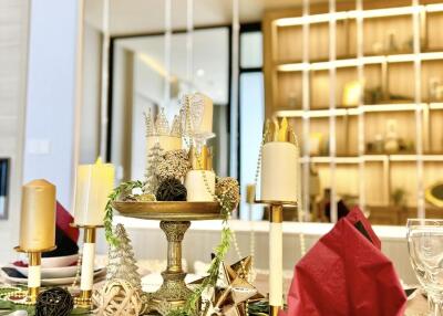 Decorated dining table with candles and festive arrangement