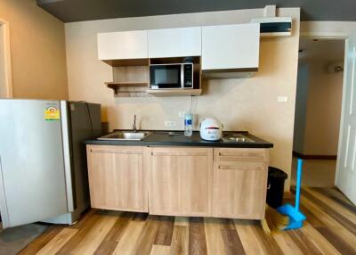 Modern kitchen with wooden cabinets and appliances