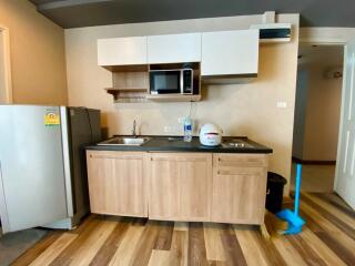 Modern kitchen with wooden cabinets and appliances