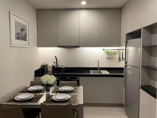 Modern kitchen with dining area and appliances