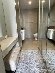 Bathroom with mirrored walls and modern fixtures