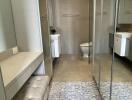 Bathroom with mirrored walls and modern fixtures