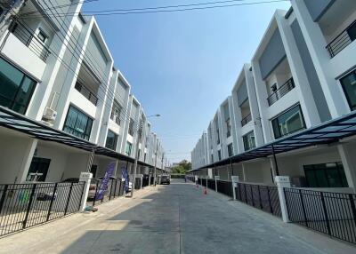 Street view of modern multi-story townhouses