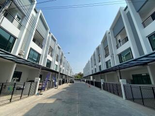 Street view of modern multi-story townhouses