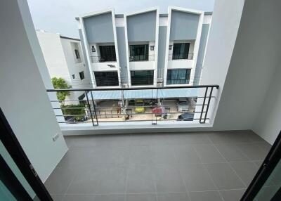 View from balcony towards street and neighborhood