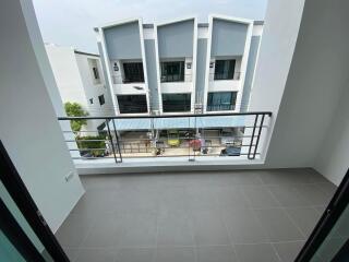 View from balcony towards street and neighborhood