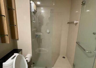 Modern bathroom with glass shower and toilet