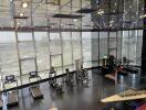 Modern gym with exercise equipment and city view