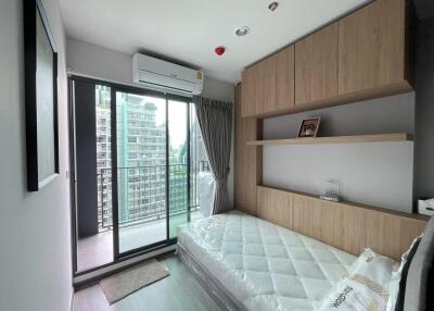 Modern bedroom with a balcony and city view