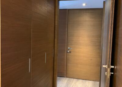 Modern hallway with wooden doors and flooring