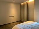 Modern minimalist bedroom with cozy lighting and thick curtains