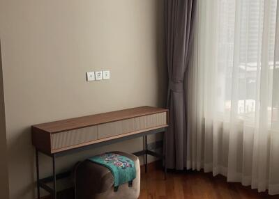 Bedroom with light pouring in through a large window