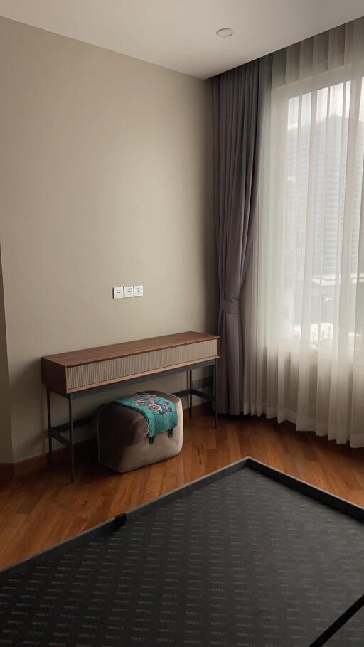 Bedroom with light pouring in through a large window