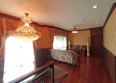 Elegant living area with chandelier and hardwood floors