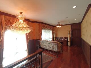 Elegant living area with chandelier and hardwood floors