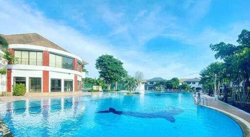 Spacious outdoor area with swimming pool and surrounding buildings