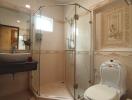 Elegant bathroom with glass shower enclosure and ornate decor