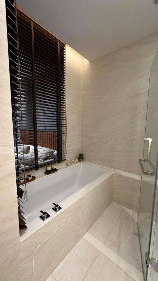 Modern bathroom with bathtub and glass shower