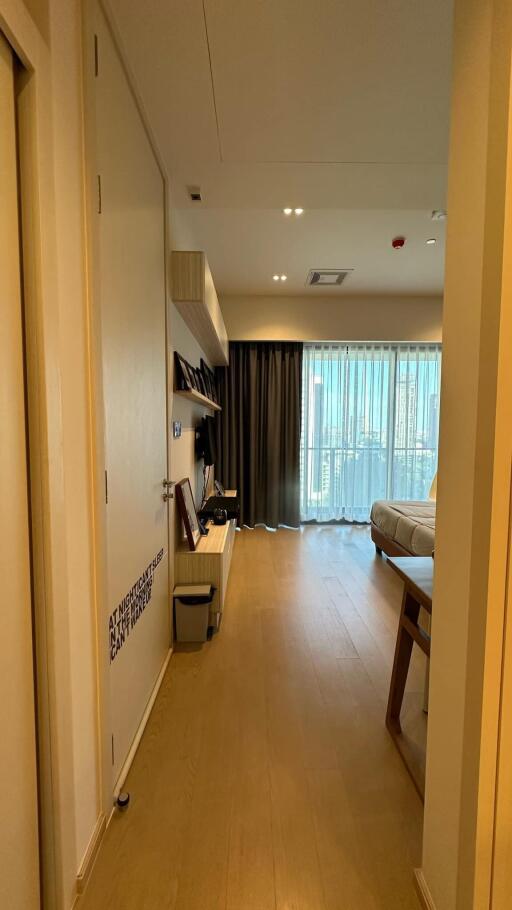 Bright living room with wooden floor and large window