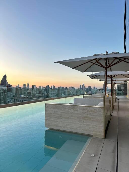 Rooftop infinity pool with city skyline view