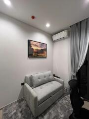 Compact living room with foldable sofa and air conditioning