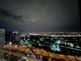 Aerial night view of city buildings and roads