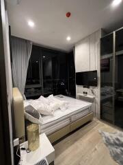 Modern bedroom with large window and night view