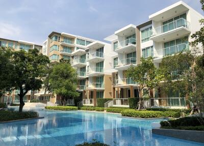 Modern apartment buildings with large windows and outdoor swimming pool