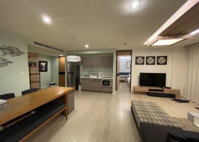 Modern open-plan living area with kitchen and dining space