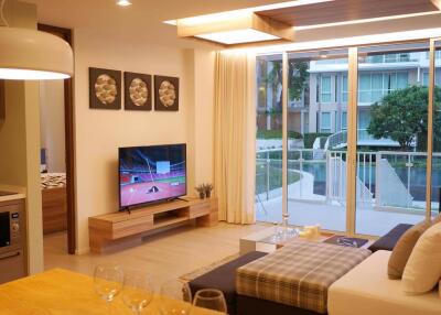 Modern living room with large windows overlooking a balcony