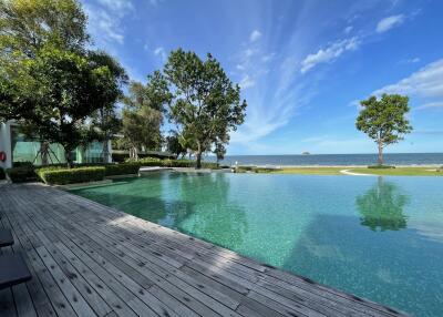 Poolside view with ocean in the background