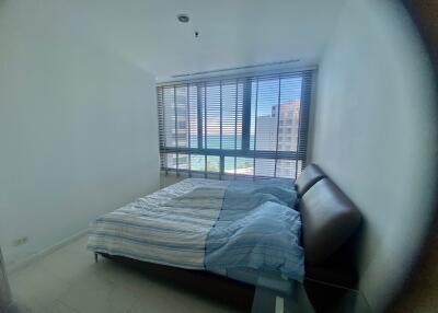 Bedroom with large window and sea view