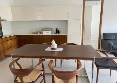 Modern kitchen and dining area with wooden furniture