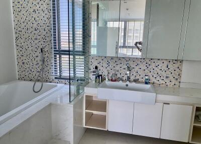 Modern bathroom with tub and vanity