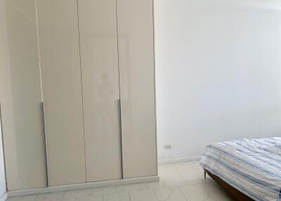 Spacious bedroom with large wardrobe