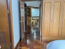 Bedroom with wooden furniture and view of adjacent space